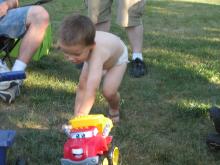 James playing with his new dump truck