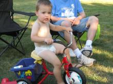 James riding his new tricycle